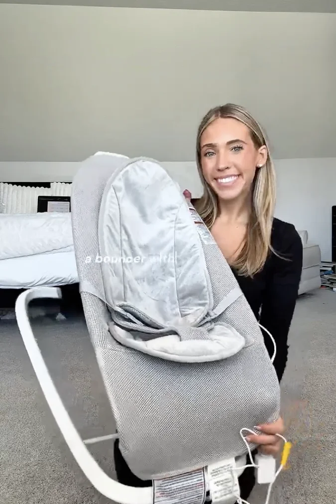 Creator holding a mesh baby bouncer