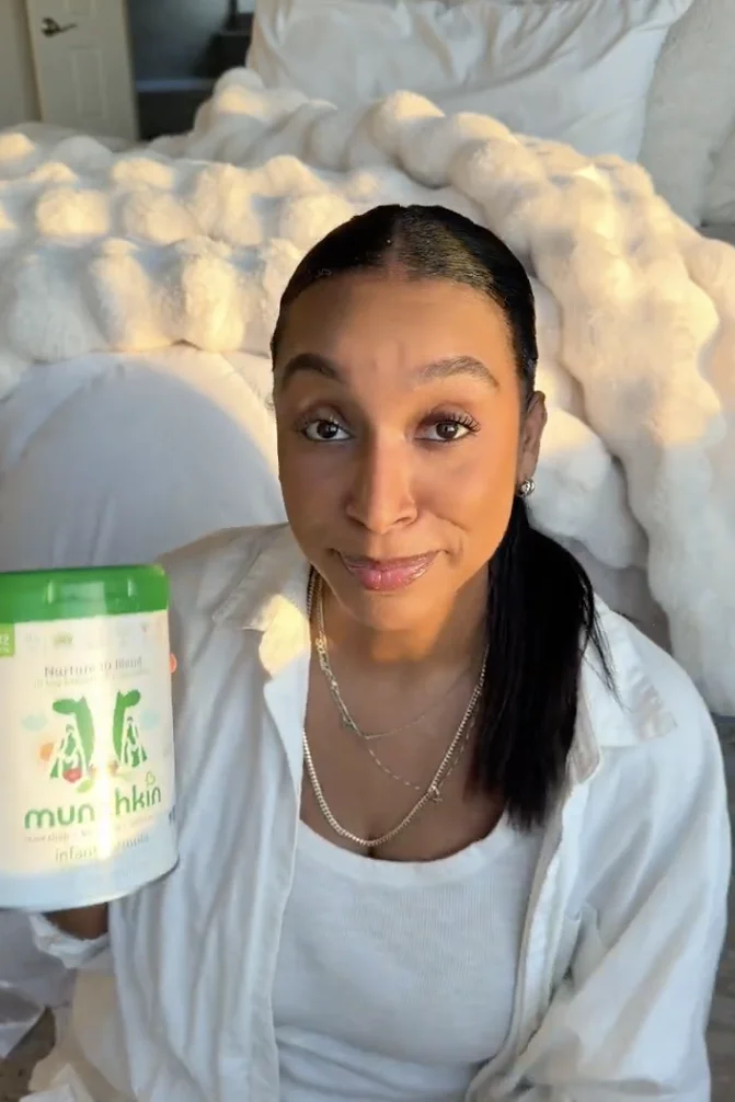 Creator holding a formula canister